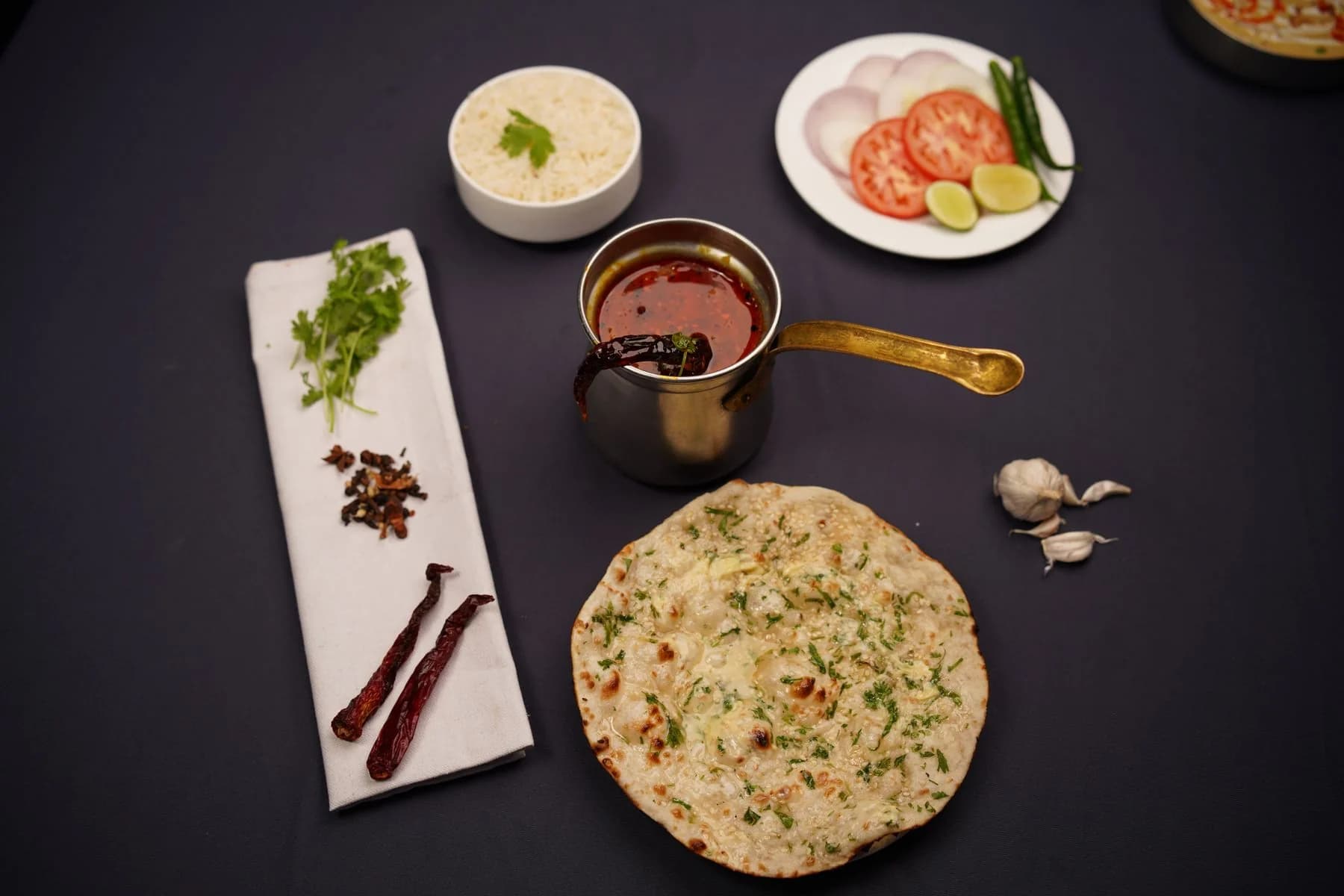 Indian naan bread and dishes, an illustrative food photograph